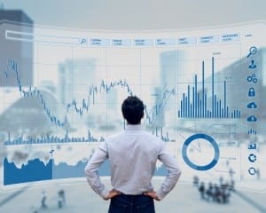 A businessman analyzing financial data and charts
